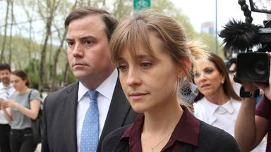 Actress Allison Mack (R) departs the United States Eastern District Court after a bail hearing in relation to the sex trafficking charges filed against her on May 4, 2018 in the Brooklyn borough of New York City